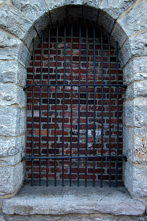 Old stone entrance with steel bars