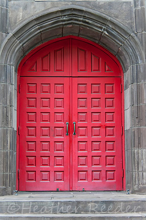 Old, elegant double red arched doors.